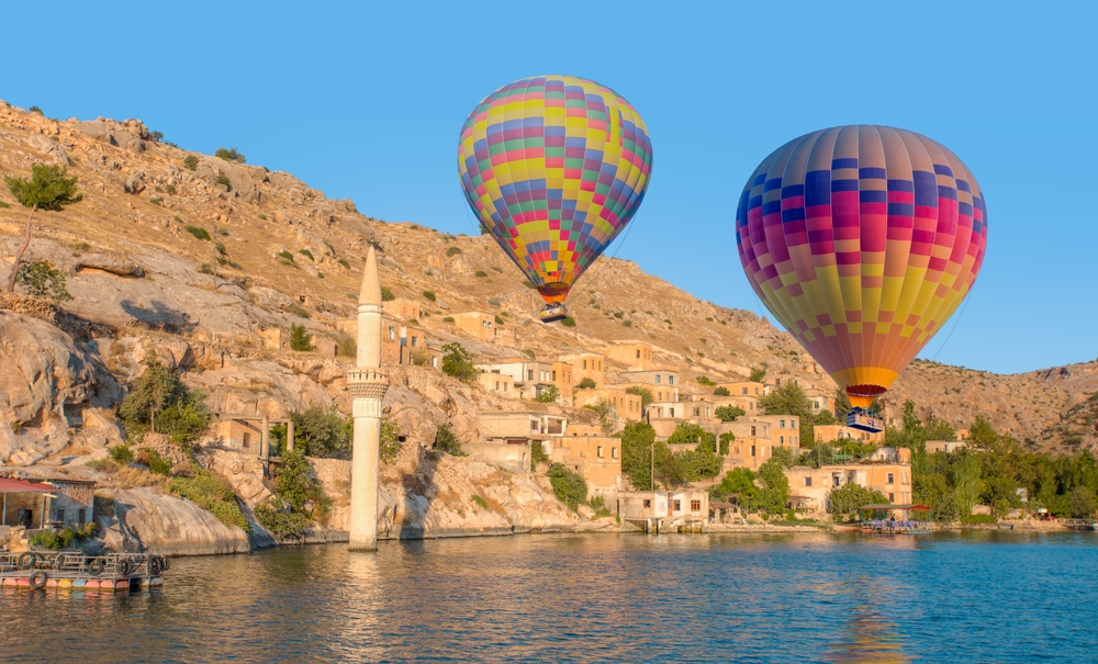 hot,air,balloon,flying,over,historical,halfeti,town,and,mosque